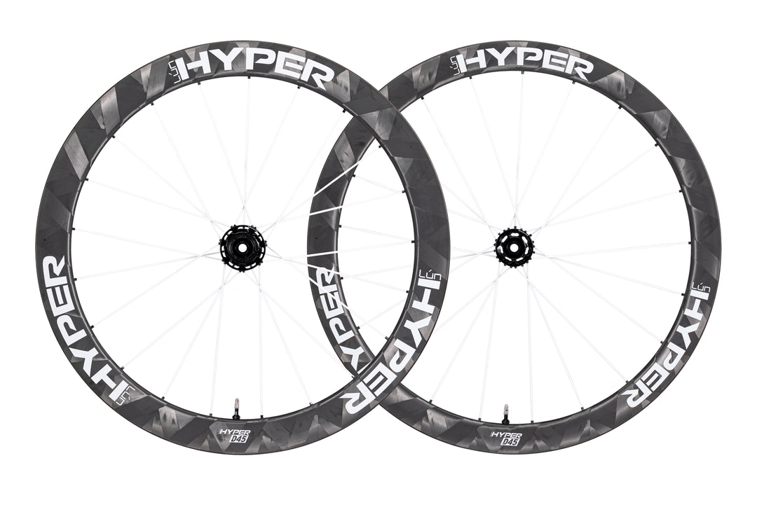 Lún HYPER D45 disc brake carbon wheelset, matte black rims, white HYPER branding, deep profile with white carbon spokes.