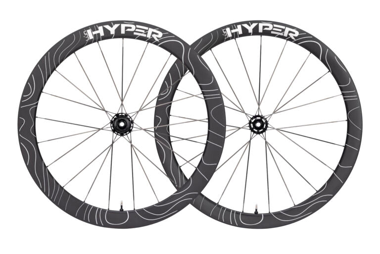 Lún HYPER D45 disc brake carbon wheelset, matte black rims with white F-RAPID design, 'HYPER' branding, product showcase.