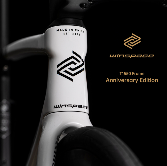 Winspace T1550 Anniversary Edition carbon road bike frame headtube with black geometric logo and gold branding.