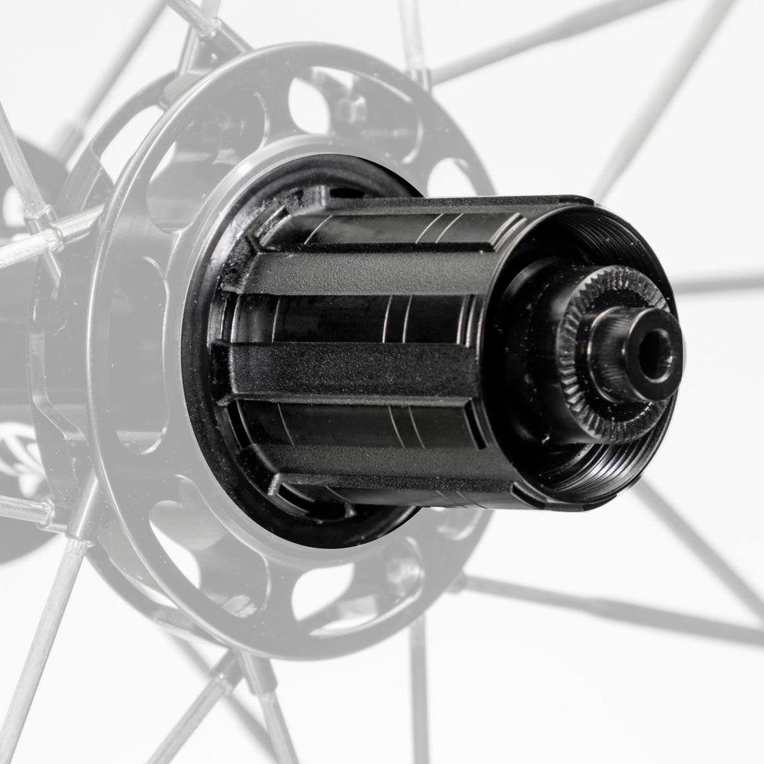 Black grooved freehub body with textured surface and knurled end cap for Lún Mega Wheels.
