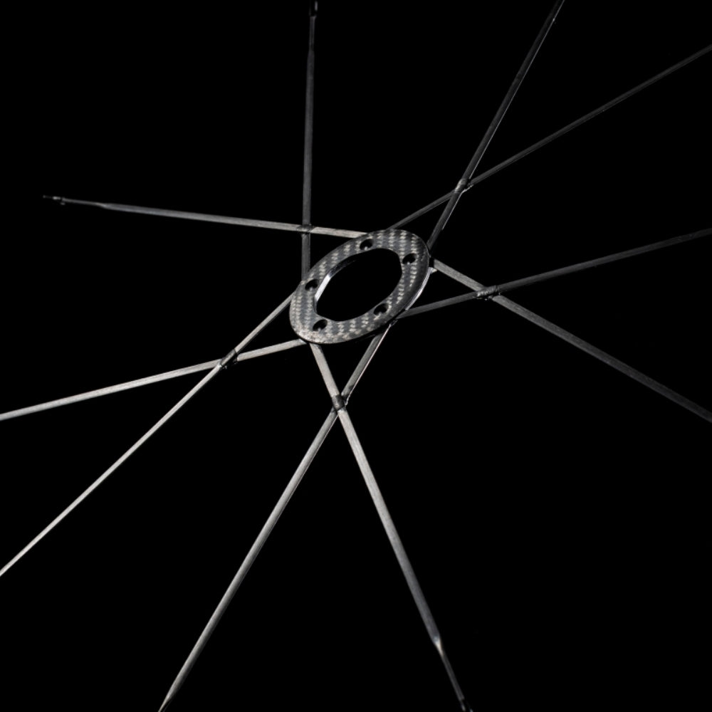 Lún MEGA D45 disc brake wheelset carbon hub with integrated Halo Spokes radiating outwards against black background.