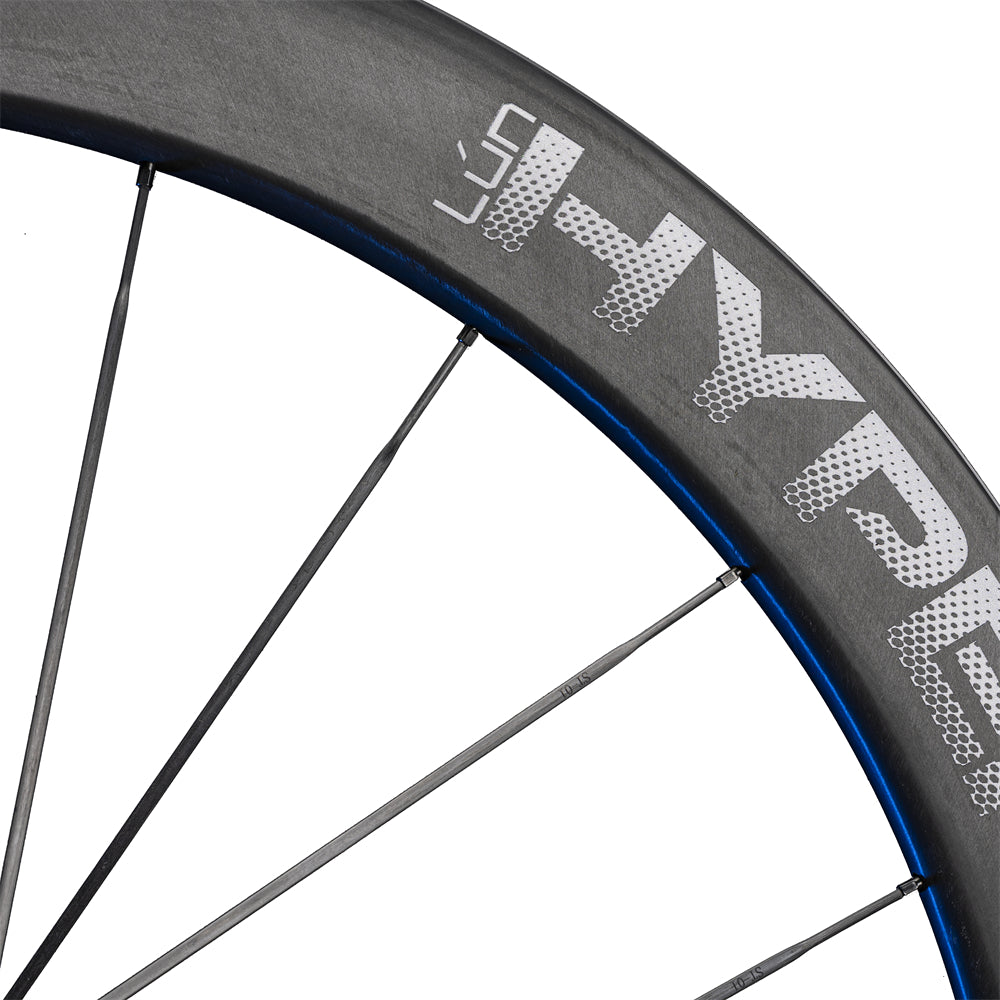 Lún HYPER 23 SE R67 carbon rim brake wheelset. UD finish, textured brake track, grey HYPER logo.