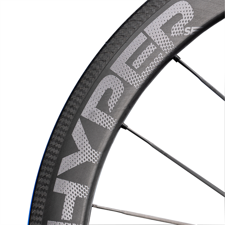 Lún HYPER 23 SE R67 carbon rim brake wheelset with textured braking surface and grey HYPER branding, UD finish.