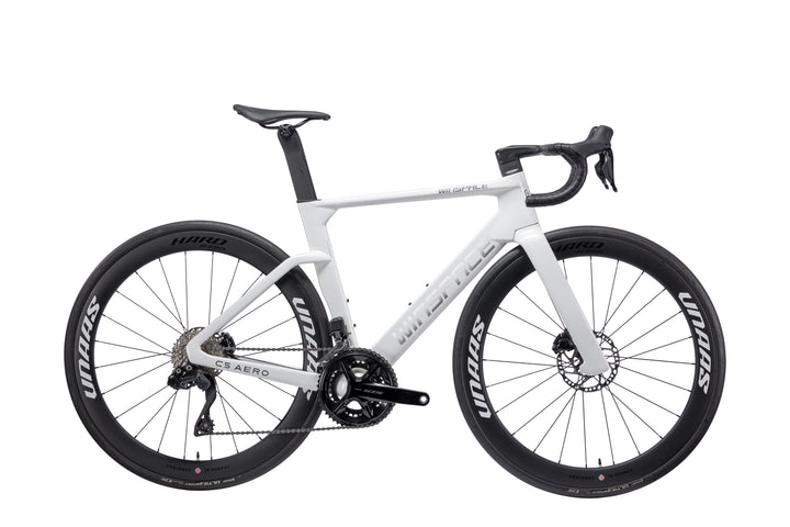 White Winspace C5 Aero carbon road bike with silver-grey branding, integrated cabling, and disc brakes.