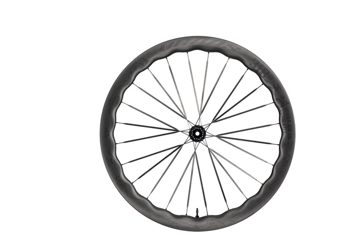 UNAAS Pro2 carbon fiber bicycle wheel with a distinctive wave rim and 'ROUTE 318' branding, black hub and spokes.