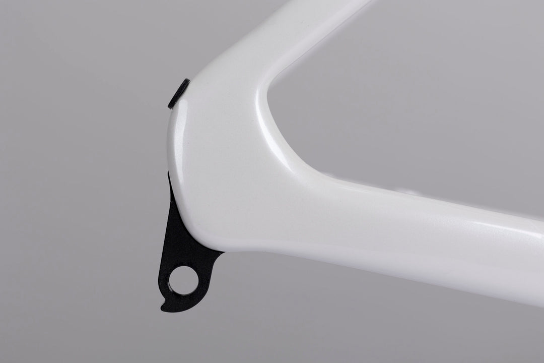 Glossy white WINSPACE Agile carbon fiber road bike frame rear dropout with derailleur hanger detail.