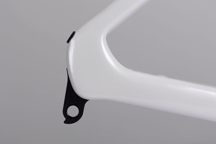 Glossy white WINSPACE Agile carbon fiber road bike frame rear dropout with derailleur hanger detail.