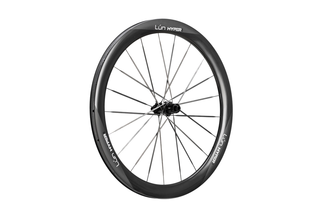 Matte black carbon fiber HYPER 5 bicycle wheel with thin spokes and LUN HYPER branding on the rim.