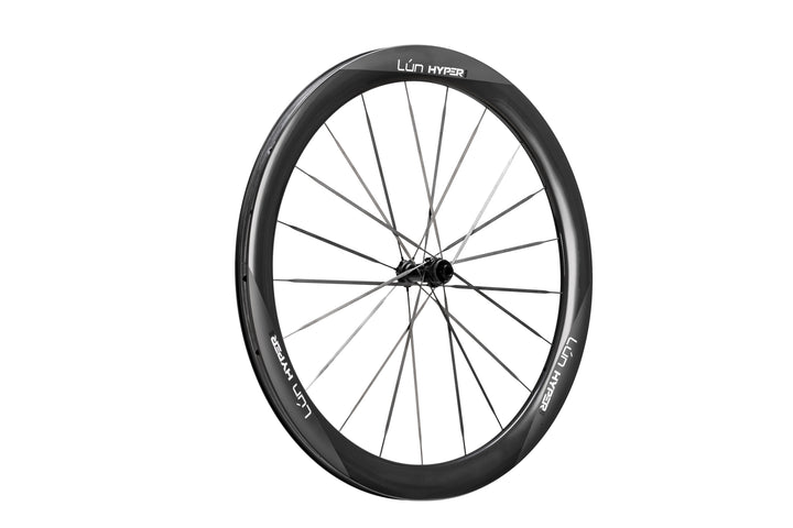 Matte black Lún Hyper 5 carbon fiber bicycle wheel with thin bladed spokes and prominent white LÚN HYPER branding on rim.