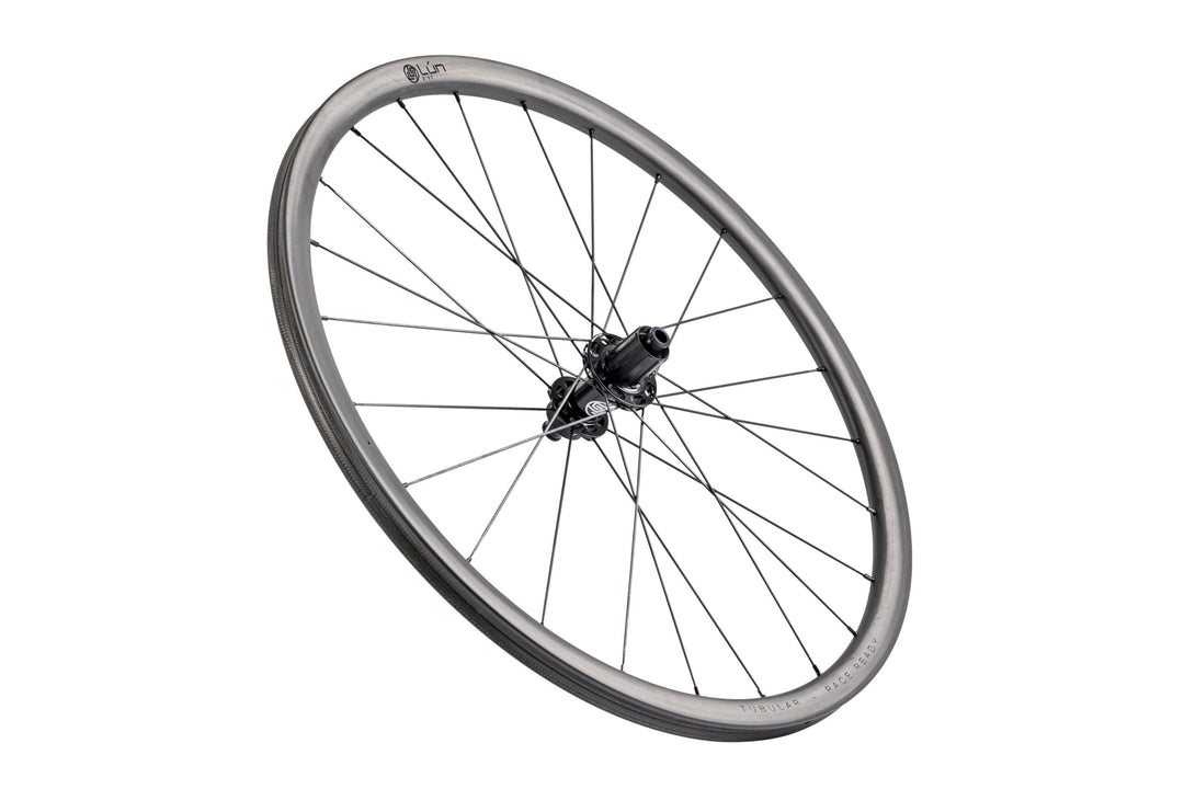 Lún Road TD30 tubular disc brake wheel, 30mm grey carbon rim with black spokes and 'TUBULAR & RACE READY' text.