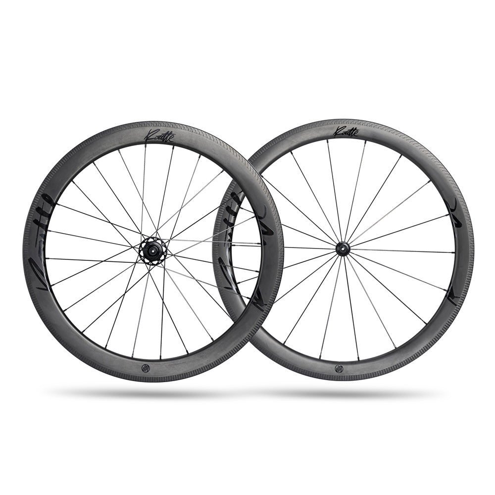Lún Routte carbon fiber rim brake wheelset, 46mm front and 54mm rear aero profiles, matte finish with black branding.