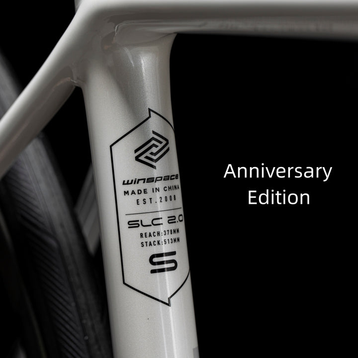 Matte white WINSPACE SLC 2.0 Anniversary Edition carbon fiber bicycle frame with gloss logo and details.