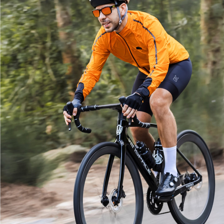 Black Winspace T1550 Gen 1 carbon road bike with disc brakes and integrated aero design, ridden by cyclist outdoors.