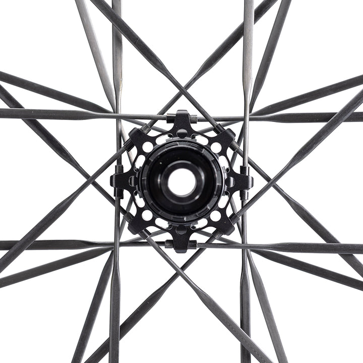 UNAAS Pro D40 wheelset hub with black ceramic bearings and carbon spokes close-up.