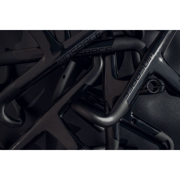 Black carbon fiber Winspace Zero integrated handlebar and stem for aerodynamic cycling.